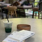 Lisa Ray Instagram - Now reading at a favoured perch in #SG #BlueisLikeBlue #TheTwiceBorn #spirulinasmoothie #deepbreaths #happyplace Common Man Coffee Roasters