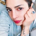 Priyanka Chopra Instagram - Sometimes you're too tired to smile. #Prague here I come
