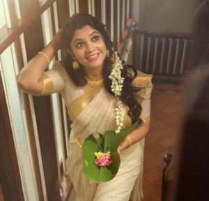 Aparna Balamurali Instagram - Happy Onam 🌸❤️

Something that happens when you have a wonderful team.
PC: @nithinnarayan 
Assisted by: @mshefin__ 

Styled by: @styled_by_gk 
Assisted by: @_cicily_cinta_ 
MUAH: @ashif_marakkar 
Accessories: @jewels_krishna 

Wearing my most favourite saree❤️
Courtesy: Amma