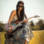 Lakshmi Priyaa Chandramouli Instagram - That's as much as I can do with a guitar. Hold and pose! Photo by @koda of Satori Studios and styling by @rajdaksh of Studio Daksh #throwbacktuesday #outdoorphotoshoot #workingwithfriends #actorslife #ilovetheguitar #needtolearntoplayittoo #satoristudios #thatribbonthough