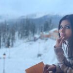 Mouni Roy Instagram - ❄️ The rooms were very still, while the pages were softly turned and the winter sunshine crept in to touch the bright heads & happy faces with white greetings. ❄️