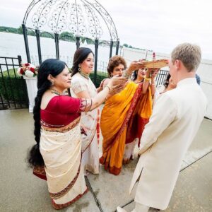 Richa Gangopadhyay Instagram - Remembering our beautiful, waterfront Indian ceremony that took place on this day, last year, and how special it was for our families to come together as Joe and I completed our Hindu Bengali rituals together (Joe is a master at reciting mantras, nbd). We were lucky to have been able to honor both our cultures and traditions and to have Joe’s family embrace, and enthusiastically participate in every nuanced element of our celebrations with open arms. ⁣⁣
⁣⁣
From the “gaye holud” (haldi/turmeric ceremony), to the “ayeburobhaat” (bride-to-be’s final luncheon with her favorite dishes), “totto” (or tatwa, groom welcomes the bride to their family) and “bor boron” (bride’s mother and female friends welcome the groom), each distinctive event bonded us closer, for life.🔒♾️⁣⁣
⁣⁣
I can’t even put into words how utterly grateful I am, and always will be, to my parents for giving their only daughter a wedding that dreams are made of. To have our extended family and friends from all over celebrate our union over the three-day wedding events was indescribable, and on our anniversary, revisiting over 3000 photos brings us back to the fun, laughter, tears of joy (and yes, of course a little bit of chaos…it’s a fusion wedding!). 🥳⁣⁣
⁣⁣
We are blessed beyond words, for having each other and for having our families love and support us till the very end. We love you Ma, Baba, Deb and Steve!🥰⁣⁣
⁣
Venue: @roostertail
Makeup: @jhobby21 
Hair: @hairbyaysha 
📷: @kelliesaunders