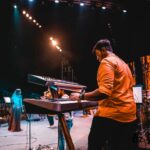 Haricharan Instagram - Felt Sooooo good to be Back on Stage with my Band. Thanks to the wonderful audience for Singing along 😍😍 Last Night at Thiruvananthapuram for the Inauguration of @keralaolympic Pics by @ebysolickal University Stadium