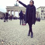 Bhumi Pednekar Instagram - So this is going to be my thing every time I visit a touristy monument- click a picture in the most cliche but cute,am holding the monument kind of pose🙈So here I am with my hand and tongue stretched out holding the #brandenburggate The Brandenburg Gate was made in the 18th century and today stands as a symbol of unity between Germany and other European countries. #Berlin #Berlinale2018 #vacation #work #tuesday #love #winter #brandenburggate #clichebutcute #poser #wednesday #morning