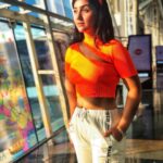Ashnoor Kaur Instagram – Pray, slay and conquer the day✨🧡
.
.
#AirportLook #WhatIWore
Top by @pankhclothing
Pants by @shein_in
📸 by @kauravneet79
#LatePost #Orange #LoveBows #sunkissed #ashnoorstylediaries #goldenhour