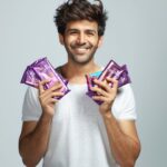 Kartik Aaryan Instagram - Officially a #ChocolateBoy now 😉🔥!!! . . Excited to be the face of my forever favourite chocolate #CadburySilk #DairyMilk ❤️😋 @cadburydairymilksilk #Silkaholic #KartikLovesSilk 🔥