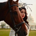 Nora Fatehi Instagram - The horse, with beauty unsurpassed, strength immeasurable and grace unlike any other, still remains humble enough to carry a man upon his back..... Stay humble guys ❤️🤎 Wearing @herveleger × @viangevintage × @delna_poonawalla Bag- @cultgaia Styling Asst @gypsy.girl.world @faisalbhattiofficial HMU @marcepedrozo Shot by @tejasnerurkarr