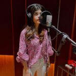 Sanjana Sanghi Instagram - That moment. That mic. That feeling of reliving & recreating each moment of what has been the most beautiful journey of my life yet. So, so many feelings. Thank you guys for being so excited yet so patient for #OMTheBattleWithin 🤍⏰ Our world will be yours, soon enough, promise. @adityaroykapur • @itskapilverma • @khan_ahmedasas • @apnabhidu • @zeestudiosofficial • @shariq_patel ______ Posted @withregram • @filmfare #SanjanaSanghi dubs for Om: The Battle Within. We can't wait to see her in their action-packed thriller!