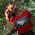 Kalpika Ganesh Instagram - Sun Blast❤️❤️ Crop top by @mayanelluri Get your printed or self customised painting by her magical hands @spoilxthestore #reddie #maya #om #croptop #ganesha #phoneclicks