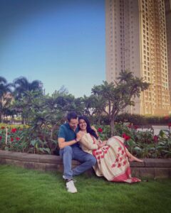 Vishakha Singh Instagram - For two non conformists - this was a first! 
Getting Vik to not wear shorts or tracks on a festival was an effort!
To get him to pose for camera was another story all together (and that cyclist photo bombing us 🤣 in the pic didn’t help )

Anyone else got a camera shy spouse? Vik is literally Chandler Bing! (F.R.I.E.N.D.S fans know what I mean ) 

Anyhow - back to US. 

The day began with poojas in our new house and posing and ended as a quiet Diwali evening eating chinese food - just him and me after years.

Hope you all had a good Diwali ❤️🪔

#HamariDiwali #Home #VikVish #diwali #diwali2022 #Love #Life #Laughter