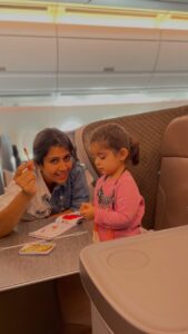 Ankita Bhargava Patel Instagram - Travelling with a toddler in a long-ish flight ! ✈️

Herez what All i did-

➡️I prepared a busy bag full of some new and some old activities.
➡️The evergreen Magnetic scribble board is a life saver.
➡️Got a new pop up book for the surprise element.
➡️Crayons,Stickers,Stamps and a drawing/colouring book are a must.
➡️We made Some pasta bracelets too.
➡️Her first official screen time happened on this flight!
➡️She got amused with the whole idea of using headphones.
However after 15 mins she didnt care much about what was going on on the screen.
➡️I made a small suitcase with extra set of clothes for both Mehr and myself.
➡️Her fav doll and fav blanket to give her company.
➡️The flight was fairly empty so she walked around and explored the entire aircraft.
➡️I made sure i gave her her fav snacks to munch on and sips of water while take off and landing to help ear pressure.
➡️Pre ordered a kids veg meal while booking our tickets.
➡️She feeds herself so it was fairly easy for me on flight.
➡️She got comfy with eating slightly spicy foods on this trip.
➡️Kept her well hydrated thru the flight.
➡️I showed her ‘Happy Feet’ as her 1st film also cos we were about to visit penguins in Singapore so that she cud relate to them better.
➡️She also interacted with a senior couple sitting behind us who were amazed at how much she talks!
➡️Lots of cuddles and Loving too !
➡️Little nap too

Over all both the journeys to and fro were as smooth as butter ❤️

P.S - Plz make sure all the vaccinations of your child are up to date.I got Mehr her Influenza shot a few days before travelling.