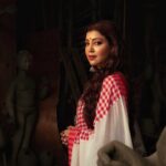 Debina Bonnerjee Instagram - Navratri honors the feminine divine power and is observed in the month of Ashwin as per Hindu Calendar. These sacred series of nine nights is believed to signify the importance of the victory of good over evil. Brahma, Vishnu and Mahesh, together with their powers gave birth to Durga, an incarnation of Goddess Parvati, the daughter of Himavat, the lord of the mountains. Maa Durga fought the evil demon over a period of eight days and finally killed him on the ninth day with her trident (Trishul). These nine days of theDevi represents the omnipresent cosmic Energy. The whole Creation is permeated by this Energy. The prosperity that we enjoy in our daily lives is a manifestation of Devi. Shot for @debinabon Executed by @jeevitaoberoi Styled & Produced by @sittingbullproductions @jununproductions @aditya_mohan @apoorvmohan @sanyogita.sao Photographed by @abhijith_sathyapalan @sujithnairphotography HMU @sandip_nag & Guddu Stylist @styledbyayushidixit @simrankhera5 Oufit @shwetaaggarwal.official #navratri #navratri2022 #devi #shailputri #kolkata #kolkatadiaries #streetsofkolkata #debina #debinabonnerjee #magicalkolkata #streetphotography #streetportraits #sittingbullproductions Kolkata