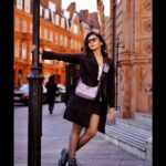 Dushara Vijayan Instagram - I’m a vibe that you can’t handle🖤 . . . Shot by : @georgesimon_m Bag : @prada Hairstylist : @renuka_mua #streetphotography #fashionblogger #fashionista #devilwearsprada #prada #black #style #styleblogger #styleinspo #fashionstyle #london #luxury