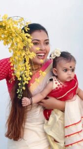 Mridula Vijay Instagram - Happy vishu from Mridva and our Muthmani 
@yuvakrishna_official 
VC @parvathy_anuz
Costume for Dwani @bellezadesignz 
Costume for me @mangalyakasav