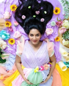 Pallavi Ramisetty Instagram - Life is like a rainbow 
You need both the sun and the rain to make its colour appear 🌈

In love with this beautiful dress
👗@siriboutique_guntur 
📷 @kidsography_by_nikhil_ronald 
💄@makeup_by_poornima 

#rainbowdress #coloursoflife🌈 #momtobe #🧿 #maternityphotoshoot #behealthy #instagood #pallaviramisettyofficial