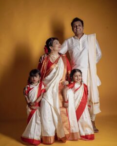 Sandra Thomas Instagram - It’s our birthday as parents to this beautiful angels 😇 

📷: @pournami_mukesh_photography 
Outfit : @meenumjoseph 
Stylist : @joe_elize_joy 
Curator: @nivethithasanjay 
Assisted by : @sanliya_sabu 
Makeup : @zara___makeover 
Blouse stitched by : @edesignsbythasneem 

#birthdaytheme #traditionalwear #bengali #thankakolusu #supernaturalfamily #family #influencer #filmproducer #toddlerlife #twins #girls #lifeline #youtubers #grandchildren #daughters #lovequotes