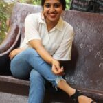Lakshmi Menon Instagram - 𝐂𝐡𝐨𝐨𝐬𝐞 𝐇𝐚𝐩𝐩𝐢𝐧𝐞𝐬𝐬 ❤️🤗 Pc: @rhisvan Accessory : @thinkal__fashionbay Shirt : @lookbook__90s #lakshmimenon #casualstyle#casualoutfits #casual #smile #happinessquotes #happiness💕 #mollywood#tollywood#kollywood#jeans #fashionphotography#outdoorphotography#loveyourself