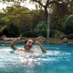 Sanjeeta Bhattacharya Instagram - Life update: Have learnt how to survive in a pool. The pool is my jam now! Have you heard the song that inspired this life lesson and watched the video yet? Swimming is out now! Link in bio🌊 Hihi💛 #swimming #newrelease Auroville