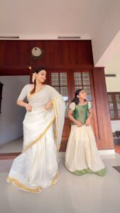 Aditi Ravi Instagram - weird but i had to 🤪 with ponnu🔥 happy onam 🙏🏻

#actually #practicing 😀#with #onamcostume #afterpayasameffect #variety #reels 

#reelitfeelit #anirudh #sharukhkhan #dance #bollywood #mallu