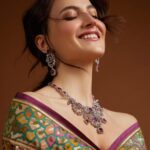 Elli AvrRam Instagram - Let’s fly together into the ‘Dream World’🦩✨ What say? Presenting @fablookmagazine new year’s special edition. Wearing this saree from @bandhanitraditionbyahasan and jewels from @jewelartic Editor & Founder @milliarora7777 @ankkit.chadha2222 Styled by @milliarora7777 @mitushigupta Mua @omkarvardam Hair @Swapnil_makeupnhair Belt @deebaco_official Shot by @nikhilshenoyphoto Coordinated by @nadiiaamalik