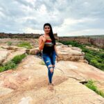 Lahari Shari Instagram - Reaching new heights, both figuratively and literally. Standing proud on this hilltop, embracing the beauty around me. The world below fades away as the drama of the sky consumes me.🌟✨ #NewHeights #EmbracingBeauty #JourneyOfALifeTime #LifeAtTheTop #DreamsAndReality #OnTopOfTheWorld #DramaticViews Gandikota Adventure Trip