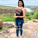Lahari Shari Instagram - Reaching new heights, both figuratively and literally. Standing proud on this hilltop, embracing the beauty around me. The world below fades away as the drama of the sky consumes me.🌟✨ #NewHeights #EmbracingBeauty #JourneyOfALifeTime #LifeAtTheTop #DreamsAndReality #OnTopOfTheWorld #DramaticViews Gandikota Adventure Trip