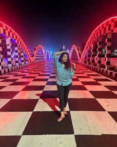 Misha Ghoshal Instagram - The inner child in me got way too excited seeing this bridge 🥺❤️ pure love and joy #colors #lighting #nightlife #chennai #bridge #marinabeach Napier Bridge, Marina Beach , Chennai