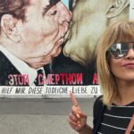 Ranjini Haridas Instagram - The Berlin Wall - Possibly the most iconic image of the Cold War in Europe . For many years, the Berlin Wall separated East Germany from West Germany, acting as a physical barrier that symbolised the political divisions of the time. It was a symbol of the Iron Curtain, and its destruction marked the end of communist power in Germany. East Side Gallery : At 1316 metres long, the open-air art gallery on the banks of the Spree in Friedrichshain is the longest continuous section of the Berlin Wall still in existence. Immediately after the wall came down, 118 artists from 21 countries began painting the East Side Gallery, and it officially opened as an open air gallery on 28 September 1990. Just over a year later, it was given protected memorial status. #incaseyoulikehistory #whenartmeethistory #anotherbrickinthewall #berlin #eastsidegallery #germany #coldwar #artists #dedicatedreel #art #ranjiniraghavan
