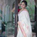 Rebecca Santhosh Instagram - V A R N A M 🪷 . . . Saree : @bybbecca MUH : @brownhue_makeup Ornaments: @golden_cup_fashion_jewellery Shot by : @akshaytomy @weddtime_stories Location : @azora.hotels . . #onam #onamreels #varnam #bybbecca