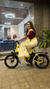 Samskruthy Shenoy Instagram - "Hello, lovely souls!

This Onam, I had a remarkable surprise – Vaan Electric bicycle! 🎁✨

It's not just a gift, but a whole new adventure. From the lightweight portable battery to the compact frame size, and the flexibility of 3 travel modes, it's been an absolute joy.

And guess what? There's a fantastic 10k discount offer waiting for you too!

Let's ride towards a greener tomorrow with Vaan Electric Cycles 🚴‍♀️💚

Get Vaan Electric bicycle on Amazon:
Vaan Urbansport -
https://amzn.eu/d/8WMsiBR

Vaan Urbansport Pro -
https://amzn.eu/d/358Ogu7

For inquiries and EMI availability, reach out at 9048122555.

 #vaanebikes #ebikestyle #SustainableTravel #greenliving #electricbike #HealthyLifestyle #actresslifestyle #gogreen #urbanmobility #BikeLove #fitnessjourney #OnamCelebrations #VaanAdventures #travelinspiration #WellnessJourney