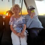 Sayani Gupta Instagram - Meet Audrey & Murray. Both 97. We met them on the Sunset cruise at Hayman. We noticed them &@smritikiran expressed how cute they were. As the 🛥️ took off I couldn’t help go say hi. And the rest is History. So A&M went to school together since they were 4..when he would carry her books for her. They were friends.. (I asked if Murray had a crush on Audrey to which she quickly quipped & said Oh YES!) she knew he liked her and of course there was an understanding. After school and beginning of collage Murray had to go for the War(WWll), he was in the navy. While he was away.. Audrey got married to another man. He came back after the war and married someone else too. They both had children with their respective partners. But kept in touch.Later they both lost their partners. One day Audrey was coming out of her house and a bike came and stood in front of her. On it was a man with 🪖& 🕶️ . She couldn’t see his face & told him why he would stop in front of her this way. As he took out his helmet, he said.. ‘Audrey, you don’t recognise me? It’s Murray!’ She couldn’t believe her eyes. They rekindled their friendship. And sometime later Murray moved in with her. They started dating 6 years ago and got married one and half years ago. Now they live in her house (not his mansion) &travel together. While Murray struggles to remember things (Audrey is sharp), She struggles to walk (Murray wheels her around). It’s the perfect Companionship. I told her how fitting her name was.. Audrey (like Hepburn)! She said ‘You have beautiful hair’. To which Murray added.. ‘Oh Darling! Just the hair! I am sitting here wondering how many marriage proposals she would get in a day!’ Audrey and I slightly choked!😂 As we spoke about other worldly things like kids & disappointments & ailments & coral reefs.. Audrey asked me if I were married & had children.. I told her I wasn’t. So she held both my hands and said.. ‘here’s to finding Mr.Right!’ (Now from their story Mr.R may come when I am 90.. who knows). But as the Sun went down & I had made new friends.. I was reminded of how unexpectedly beautiful life turns out if you let it perhaps! A&M is now, my fav love story. 🤍🤍
