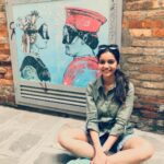 Swathi Reddy Instagram - Venice is a like a good looking person you meet whose grammar is on point. Who is proper and pretty on the outside. So you look for more hidden gems underneath the surface and you do find some but you can’t shake off a feeling of emptiness while walking away. Like nothing. Like my fake smile here. The irony of the picture behind. Sorry, Venice. Venice, Italy
