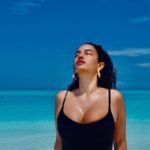 Elena Roxana Maria Fernandes Instagram - Breathe in, breathe out! . . . 📸 @titanofthesea 👗 @calvinklein 💍 @kennethcole 🏢: @kinanhotels . . #breathe #pose #sky #sea #black #blue #beauty #sun #sand #fashion #style #blackdresscode #blackdress #ootd #outfitoftheday #glam #glow #slay #beach #maldives #maldivestravel #kinan #kinanretreat
