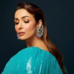 Malaika Arora Instagram - Malaika Arora sparkles in our high jewellery paisley shaped earrings handcrafted with precious tanzanites, emeralds and diamonds. @longformgram @malaikaaroraofficial Photography: @taras84 Styling : @manekaharisinghani Makeup : @mallika_bhat Hair : @hairstylist_madhav2.0 Production : @ikp.insta Dress : @rahulmishra_7 #malaikaaroraxkhannajewellers #KhannaJewellers #khannajewellerskj #IndiaModern #IndianJewellery #AweInspiring #ContemporaryDesign