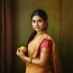 Meenakshi Govindarajan Instagram - Embodying an ageless masterpiece with a touch of modern grace. Channeling Raja Ravi Varma's exquisite artistry, @meenakshigovindharajan_ revives the essence of 'Woman Holding a Fruit' artwork. This representation intertwines innocence with sensuality, echoing soft hues of pink and brown that bring forth the gentle beauty of the original masterpiece. An ode to the past, a vision for the future. In frame: @meenakshigovindharajan_ ✨ #midjourney #aiartcommunity #generativeart #midjourneyart #aiartwork #aiart #portrait #kerala #india #love #tamil #women #saree #meenakshigovindharajan #indianactress #indianactor #tamilcinema #indiancinema #kollywood #rajaravivarma #painting