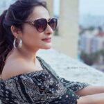 Rethika Srinivas Instagram - Style is a reflection of your attitude and your personality ✨ #rethikasrinivas #rethika #bright #smile #goodday #spreadlove #postivevibes #confidence #elegance #love #moodygrams #gown #terrace #black #sunglasses