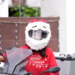 Sharanya Turadi Instagram - Trying to take Christmas feels wherever I go 🧑‍🎄🎄😃 #christmas #santahelmetcover #christmasgoodies #PrimeReels #chennaibikers #rider