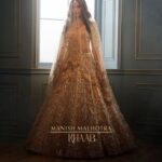 Heena Achhra Instagram - #Repost @manishmalhotraworld with @let.repost • • • • • • A longing graceful #mmveil layers a bride's emotion from all, preserving her sacred love. She adorns a Crème brûlée dupion crepe lehenga embroidered in delicate scallops with mukaish, metallic sequins, and antique metallic zardozi threads. #Khaab Bridal Couture 2022 @manishmalhotra05 Jewellery: Manish Malhotra Jewellery by Raniwala 1881 @manishmalhotrajewellery Production: Manish Malhotra Productions with the line producers @ikp.insta Photographer: @tarun_khiwal Stylist: @harshad.fshn Hair: @cristianocpereira Make up: @deepa.verma.makeup Talent: @heerachhra #ManishMalhotra #ManishMalhotraWorld #manishmalhotrajewellerybyraniwala1881 #ManishMalhotraVows #ManishMalhotraLabel #ManishMalhotraProductions #ManishMalhotraJewellery #ManishMalhotraVows #bride #bridal #bridaldress #bridesofindia #brides #indianbride