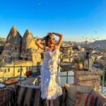 Kritika Sharma Instagram - The most favourite part of my turkey trip to do this 🤍 #gratitude Outfit @sainygargcouture Styled by @_vaishnavii.3011 Location @sultan_cave_suites #travel #whitedress #cappadocia #hotairballoon #photoshoot #terrace Sultan Cave Suites