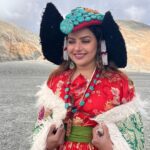 Madhu Sharma Instagram - Ladakhi traditional dress Goncha or Kos or Sulma are the main dress worn by all the communities in Ladakh by both the sexes, accompanied with a colourful sash tied around their waist. The women's robe, however, flares downwards with small pleats accentuating it into a flowy gown.Goncha or Kos is a voluminous robe resembling a coat made of wool, velvet, cotton, polyester, or a combination of these. Pangong Tso