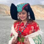 Madhu Sharma Instagram - Ladakhi traditional dress Goncha or Kos or Sulma are the main dress worn by all the communities in Ladakh by both the sexes, accompanied with a colourful sash tied around their waist. The women's robe, however, flares downwards with small pleats accentuating it into a flowy gown.Goncha or Kos is a voluminous robe resembling a coat made of wool, velvet, cotton, polyester, or a combination of these. Pangong Tso