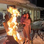 Nithya Das Instagram - Everything’s better around a campfire 🔥… #snow #vacation #campfire #traveller #2022