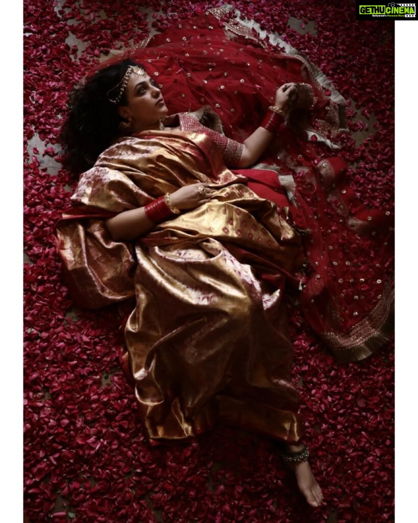 Nithya Menen Instagram - On this auspicious occasion of Navaratri - This is inspired from a vintage painting from India depicting a woman in red saree. The Divine Feminine - Goddess Durga is considered to be the physical form of ‘Shakti’ or ‘Universal Energy’. She was created by the Hindu Gods to annihilate the notorious demon ‘Mahisasura’. Reimagine is an attempt at creating a fresh look and feel about a character and spinning a new story out of them. But all are re-interpretations with an intriguing approach, while retaining the visual essence of the original works. Creative direction and styling, make up done by @rishabhad Photography done by @sauvicksengupta Clothes @jayshree_studios Jewelry @tahir_somethingsopure