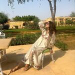 Raveena Tandon Instagram - In an around … soaking up the sun…☀️ Ootd-Outfit - @chandrimaofficial Styled by @poojagulabani