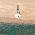 Aakriti Rana Instagram - The pictures that he clicks of me with our drone ❤️🥹 From a person who never cared about taking pictures to someone who loves taking videos and photos just cz he found a toy (drone) he is absolutely thrilled about 🤣🤣 📍 Phu Quoc, Vietnam #aakritirana #aakritiandrohan #drone #djimini3pro #dronephotography #photoshootideas #couplephotography
