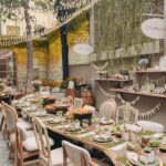 Alanna Panday Instagram - Transformed my home into the cutest little Italians farmers market for our Haldi 🌼🌻 We met @thea3project a year ago and told them much we love to travel and how we want each wedding event to remind of us of a place we love the most. We worked together for almost a year to make this vision come to life! When guests first walk in they got to pick up little baskets to take home organic goodies displayed on wood shelves. We had a little gelato stand to the left with freshly made ice cream and a long grazing table in the middle to start of the celebration with an intimate brunch. My favourite part was probably the flower stand where guests could make their own bouquets to take home. The back of the yard featured an olive tasting bar and the most beautiful gradient floral wall. The inside of the house had a live pizza station and bar with Italian themed drinks. No amount of content can do justice to how beautiful the decor turned out! Florals by @blacktulipflowers_india
