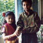 Bhakti Kubavat Instagram - That was my childhood - simple & beautiful - just like a bed of roses. On the left is my mama’s son sunny! The elder brother who was so much fun. We would get chocolates from Tanzania and my nani would send us frocks & games. We were so excited when he would visit us. Next to him is Kanjibhai - the first caretaker who stood next to my dad when he opened his first clinic. My dad taught him everything, from taking an ecg to protecting us when he was not around saving lives. Ofcourse next to him is me - with a red rose and gulabi lipstick, yes i was allowed to wear makeup on special occasions like rakshabandhan, diwali & my birthday, haha. By my side is my twin brother and my partner in crime. For me he was my hero - whatever vicky will do - i WILL do. We would go to school in ghoda-gadi, play playstation, nintendo, cricket & our favorite was “nadi-parvat”, keep the coins on a railway tracks, chill will “kaju”. And above him is Didi - always protective & always helping mom. She would burn bridges if she would see tears in my eyes. She loved me/us fiercely. I would always look forward to weekends for we knew we would be chilling with the lions and the deers at sasan & go on a roadtrip. I’m so proud of my childhood as it was nothing less than a fairytale. I don’t remember i ever cried - yes i mean i would once in a while only when my house help “Lata” would go home or when kaju (the boy who lived in the hut next to the railway tracks - our best friend) would go away for find work near the suburbs. We would wait for him to join us in the evening and tell us some crazy ghost-stories. This was our life! And imagine now, everyday feels like a struggle! I wish i could tell the 5 year old me, that growing up is the most toughest thing. I would’ve got my arms stronger to save myself & protect the people i love. Those were the best days of my life ✨ So my advice, don’t forget to cherish lil moments along the way :) P.S. Did you miss my bindi ? ;)