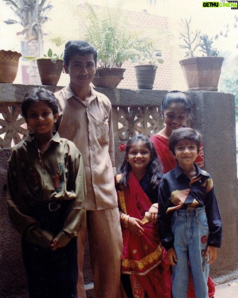 Bhakti Kubavat Instagram - That was my childhood - simple & beautiful - just like a bed of roses. On the left is my mama’s son sunny! The elder brother who was so much fun. We would get chocolates from Tanzania and my nani would send us frocks & games. We were so excited when he would visit us. Next to him is Kanjibhai - the first caretaker who stood next to my dad when he opened his first clinic. My dad taught him everything, from taking an ecg to protecting us when he was not around saving lives. Ofcourse next to him is me - with a red rose and gulabi lipstick, yes i was allowed to wear makeup on special occasions like rakshabandhan, diwali & my birthday, haha. By my side is my twin brother and my partner in crime. For me he was my hero - whatever vicky will do - i WILL do. We would go to school in ghoda-gadi, play playstation, nintendo, cricket & our favorite was “nadi-parvat”, keep the coins on a railway tracks, chill will “kaju”. And above him is Didi - always protective & always helping mom. She would burn bridges if she would see tears in my eyes. She loved me/us fiercely. I would always look forward to weekends for we knew we would be chilling with the lions and the deers at sasan & go on a roadtrip. I’m so proud of my childhood as it was nothing less than a fairytale. I don’t remember i ever cried - yes i mean i would once in a while only when my house help “Lata” would go home or when kaju (the boy who lived in the hut next to the railway tracks - our best friend) would go away for find work near the suburbs. We would wait for him to join us in the evening and tell us some crazy ghost-stories. This was our life! And imagine now, everyday feels like a struggle! I wish i could tell the 5 year old me, that growing up is the most toughest thing. I would’ve got my arms stronger to save myself & protect the people i love. Those were the best days of my life ✨ So my advice, don’t forget to cherish lil moments along the way :) P.S. Did you miss my bindi ? ;)