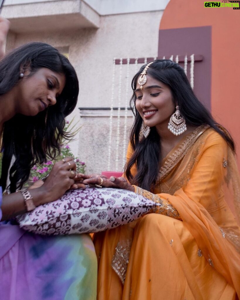 Deepika Venkatachalam Instagram - #Weddinglookbook Mehendi ✨ !! (1/3) “An outfit that gleamed sunset🧡” The theme that we picked up for our mehandi was "Punjabi" & decided to go for outfits that resonated their culture and vibe. It was our stylist @stylingbysamiha who come forward to us and told us to choose from the native colours of Punjab like orange, green or purple to maintain the mood board and my mind immediately went to all those yesteryear Hindi movies where they graced around with patiaalas and short kurtas. @jigarmaliofficial had this gorgeous orange sharara set with an organza dupatta, gold dori & aari embroidery and it was love at first sight for me. I was already thinking of other occasions to wear this over and again! 🥹 Since the dress by itself spoke gorgeousness, samiha suggested minimal jewels that would resonate a Punjabi bride. She herself handpicked the dazzling Tikka and big jumkha from the brand @fineshinejewels and we loved how it complimented the outfit and it gave a neat finish as a whole. Neatly crafted outfit, droolworthy jewels, of course the stunning makeup from @vishualizemua , a cute max hairdo from @saisubha_hairstylist & my tiny shy from the bride to be face of mine gave the evening a whole different glow and I definitely felt right out of the book of an Indian Princess!!🥺 The evening set it's tone 🌥️with family and friends walking to our own terrace to have some fun talk, apply mehendi on their hands and some beautiful music to the ears! . . . . More to come!!! Wait for it!! . 📸 @sakshi.ramakrishnan #RnD #RnDwedding