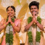 Deepika Venkatachalam Instagram - #Weddinglookbook Kerala themed Engagement (5/5) 💕✨ After that breathtaking lehenga, it was time to change for "Ring Exchange" 💍 and we had no heart to change the mood board and color palette for the second outfit! But wanted a quick changeover and went for this pleasantly beautiful gold saree that had a blush pink border adorned with motifs of the tree of life from @muhurth.brand ❤️ We looked into 50+ sarees from multiple brands but my heart said "Go for this" RVP approved too! 🫶🏼 The saree by itself was a beauty and just to add some grace to it we went on to experiment with blouse designs. That's exactly when @d.sign.d came in and gave us a lot of ideas & finally our choice was this blouse with intricate embroidery that added a hint of simplicity, sophistication and tradition to the overall look❤️ Nextuhhhh....Jewelsuhh😌 Our pro stylist @artra_styling suggested to go for a bright temple look jewelery with bright red stones and emeralds to amp up the saree and I abided by it only to find the perfectly looking set from @vriksham that definitely added the touch of gorgeousness. ✨ Oh yes, for my groom! 🫶🏼 Raja wanted the changeover for the ring exchange to be simple. He preferred a "Veshti" and our stylish gave us the choice of pairing it with a Kurta in the same golden shade. As always, his silk veshti and his silk fabric for the kurta were picked from Nalli! We took it all to our Malar Akka @fiorebymalar_ and she made the kurta that looked so good on him! 🥺🫶🏼 Like I said he wanted minimal dress up and just went ahead with his chain and bracelet only! I must admit it all fell in place so beautifully for both of us and we got lucky to figure out the finest people around us to ensure everything fell in place and our day was indeed filled with love and love only! 🫶🏼💕 . 📸 @photonimage_by_daran Decor @tharunam.in Jewellery @vriksham Saree @muhurth.brand Blouse @d.sign.d Styling @artra_styling Makeup @kabooki_mua . #RnD #RnDwedding